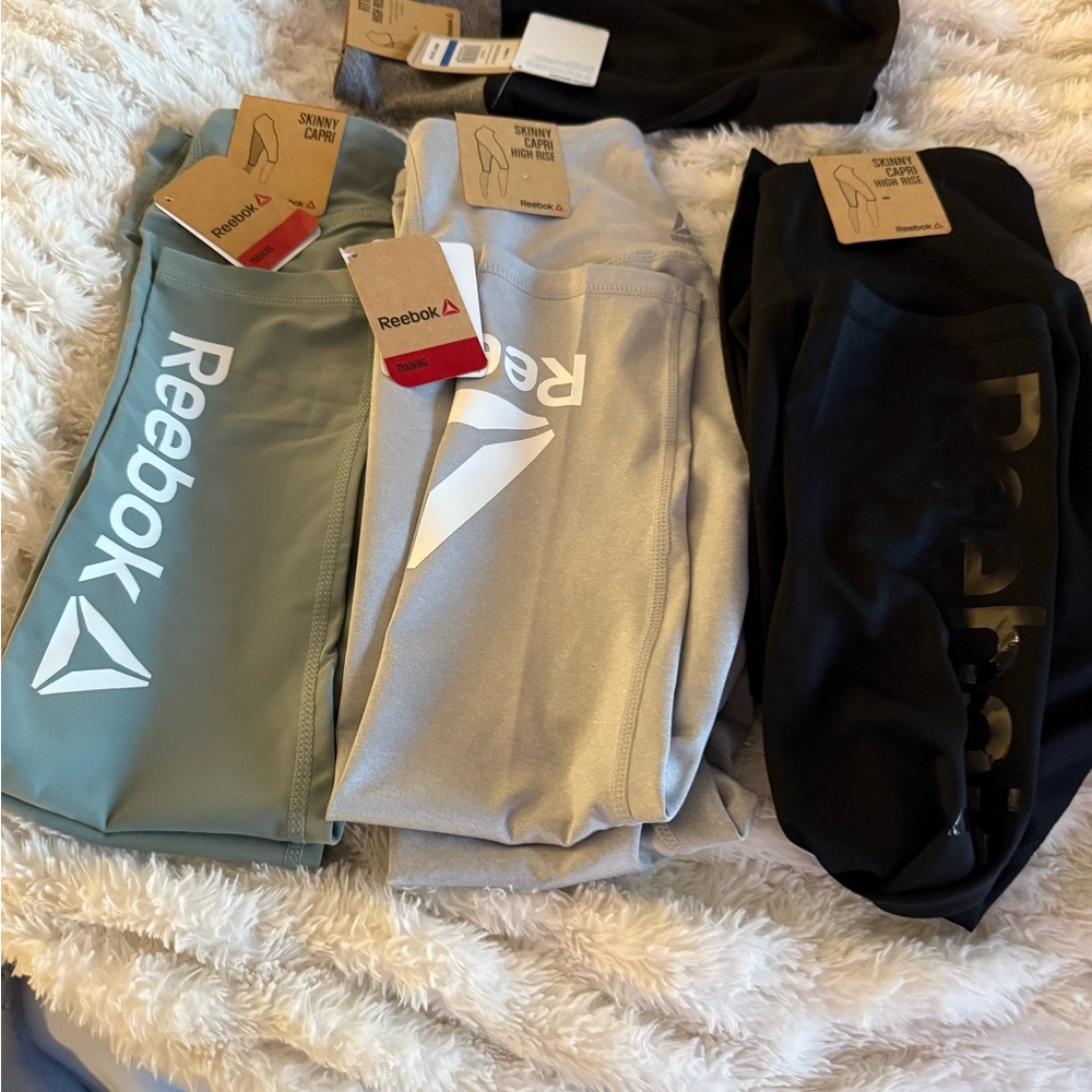 Reebok Women's Capris - Set of 4 1-Mint, 1-Silver, 1-Black and 1 black short. - Picture 1 of 14